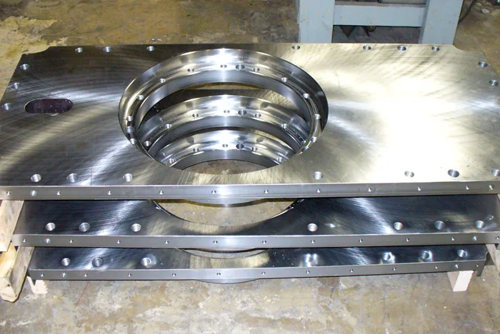 Machined stainless plate assembly with a large bore